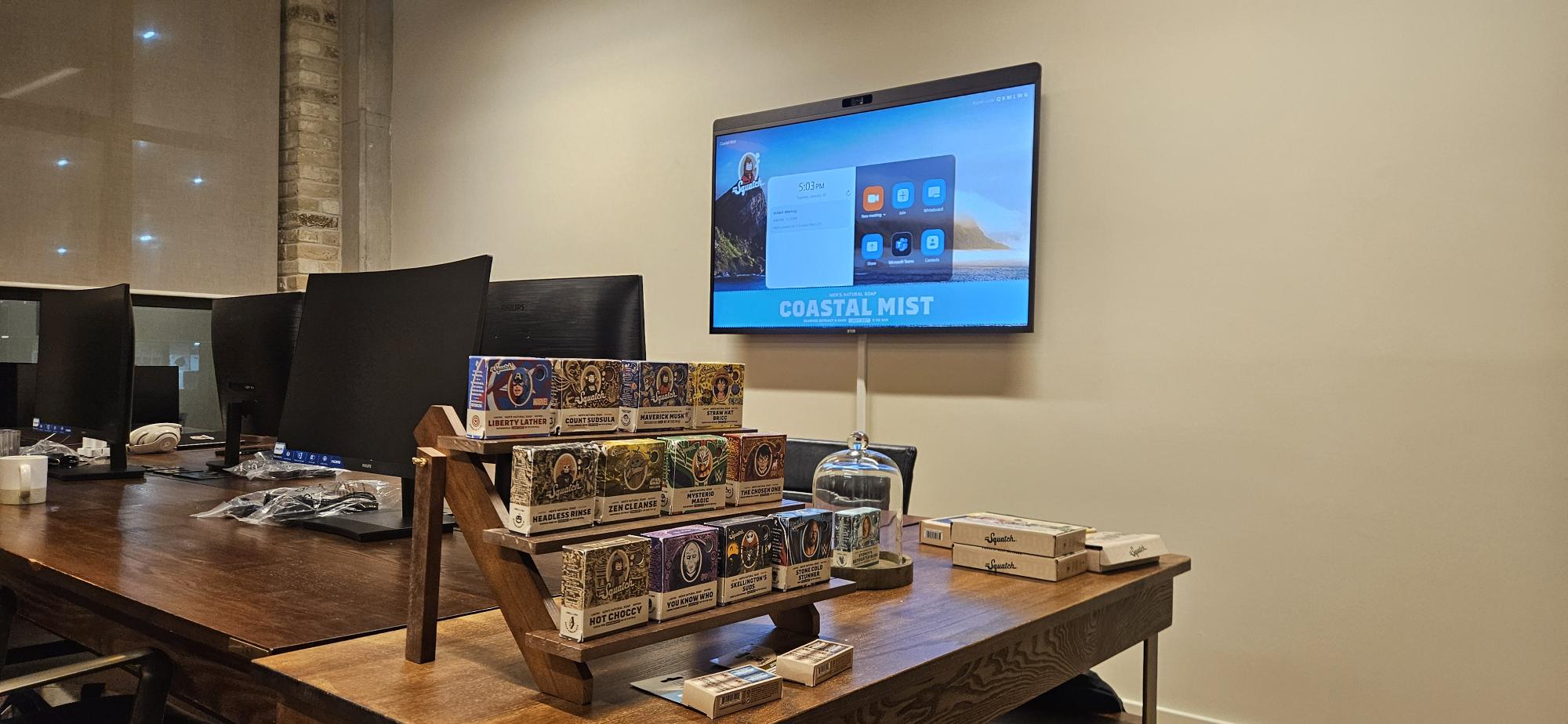 Dr Squatch London office meeting room with Zoom screen and workplace AV setup ready for day-one collaboration